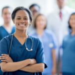 Photo of a nursing student with other in a blurred background.